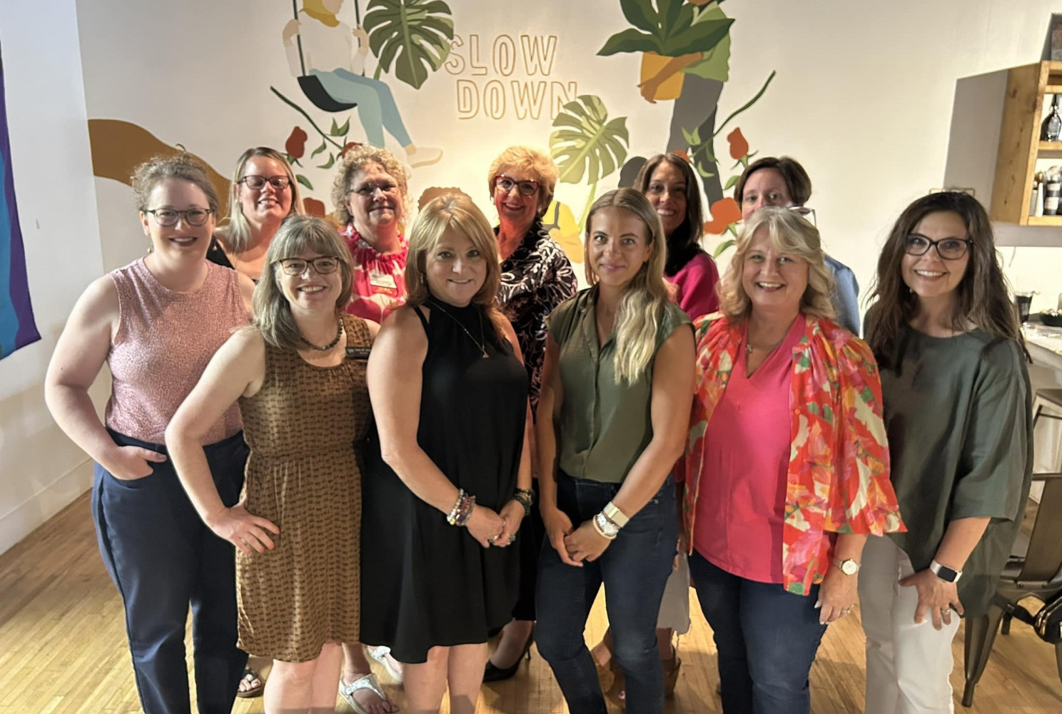 NAWBO Iowa members and guests posting for a picture at a coffee event